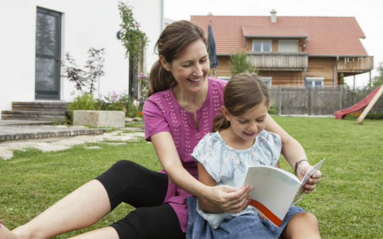 description of image used as header image in the childs journey section image of mother and daughter reading