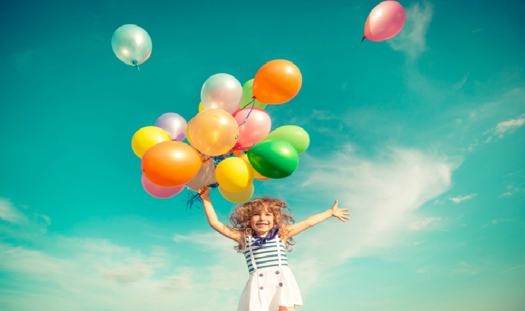 Description_of_image_used_in_health_and_wellbeing_children_foster_care_quick_guide_girl_playing_with_balloons