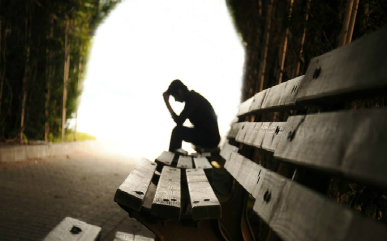 Description_of_image_used_in_impact_of_neglect_on_adolescent_boy_sitting_on_bench