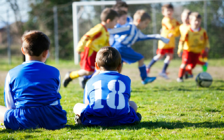 Description_of_image_used_in_leisure_activities_foster_children_boys_playing_football